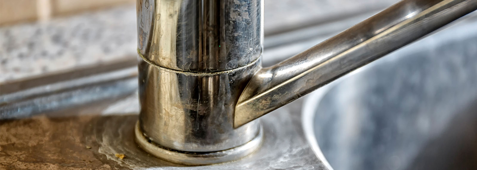 a sink with limescale buildup